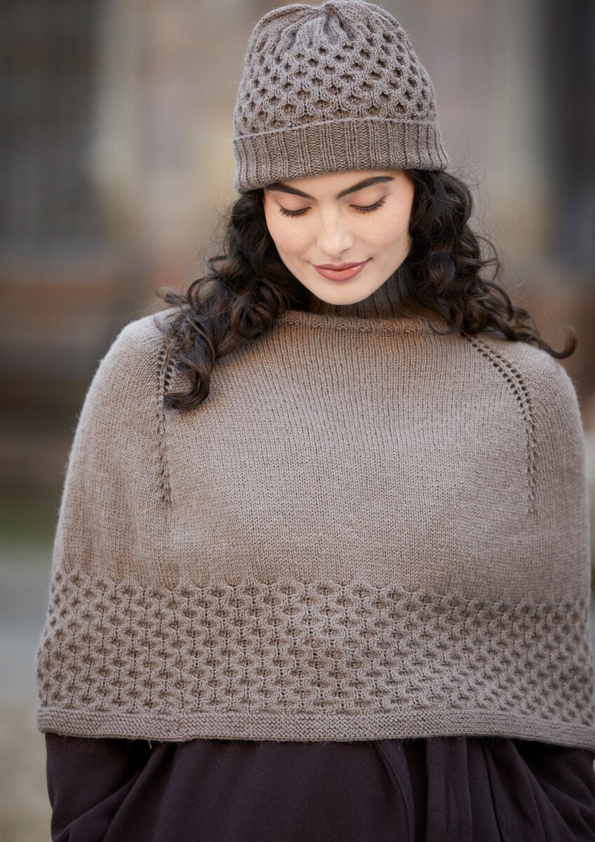 Rosalie Damen Strickanleitung von MODE at ROWAN für Poncho und Mütze mit Wabenzopf, entworfen von Martin Storey