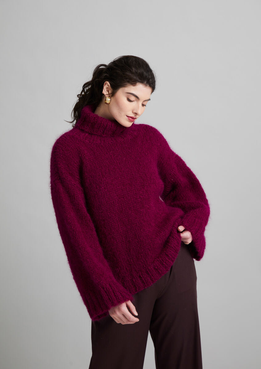 Portofino Strickanleitung für einen eleganten Damenpullover von MODE at ROWAN mit lockerem Schnitt und hohem Kragen